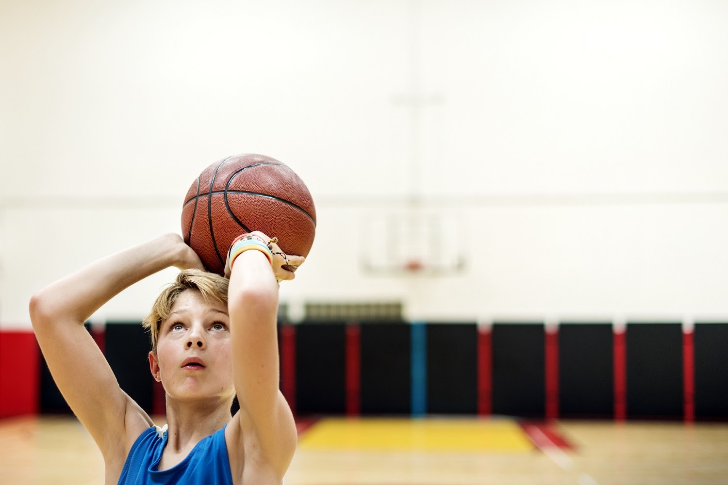 young-caucasian-boy-playing-shooting-basketball-stadium.jpeg